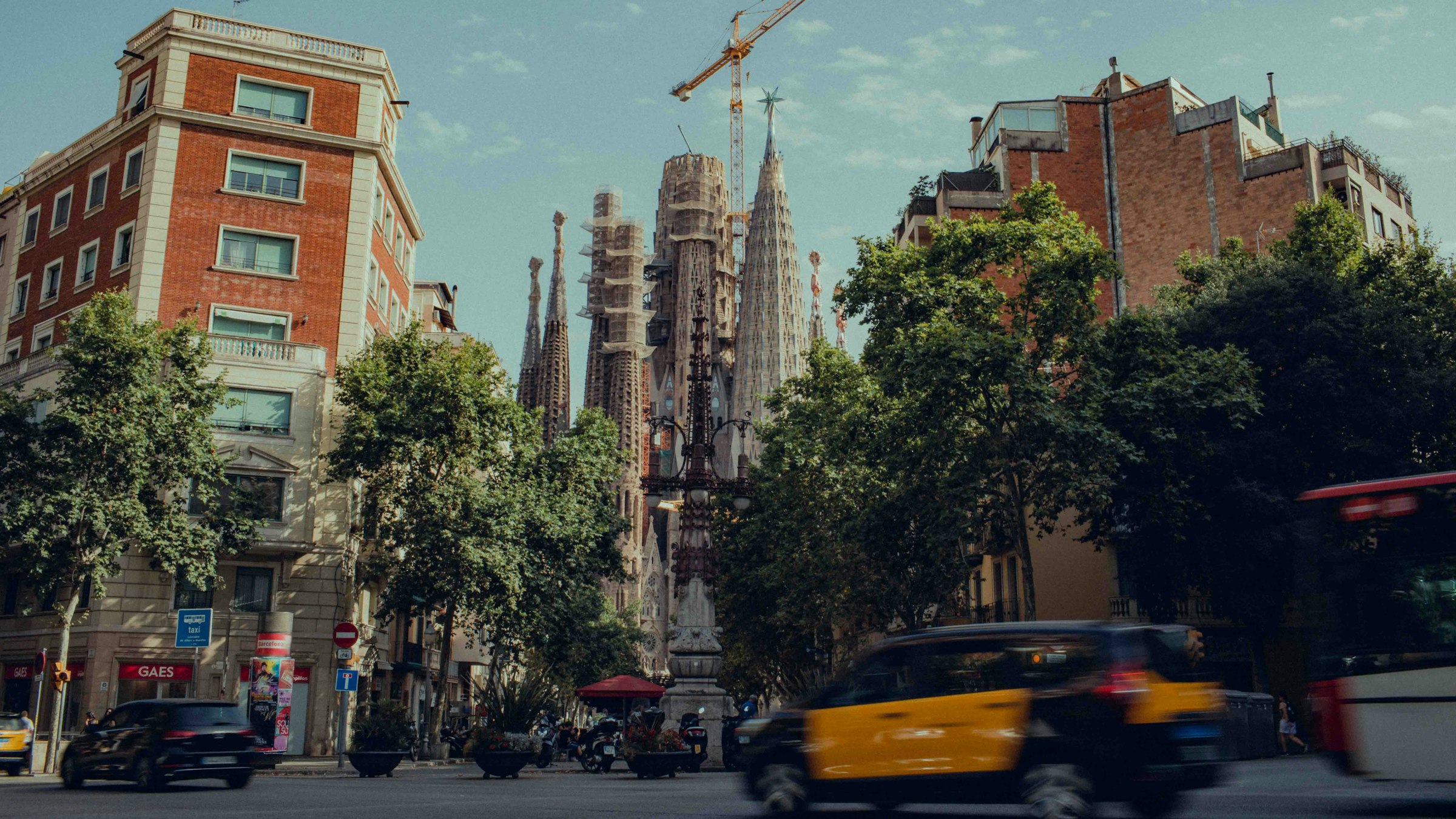The Sagrada Família from a side street. The course passes it at about 13.9 km. Photograph: Tom Morbey, Unsplash.