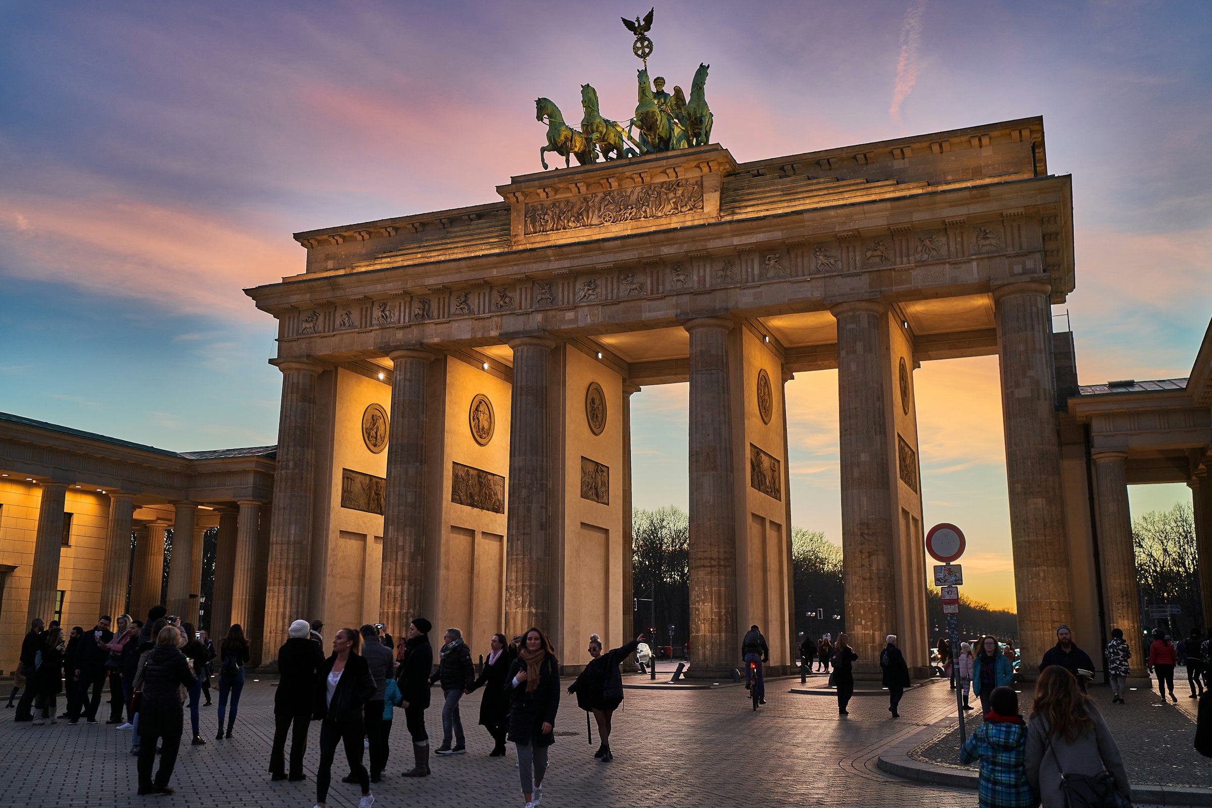 The Gate at golden hour. Runners come through it on Unter den Linden with the finish a few strides beyond. Photograph: Norbert Braun, Unsplash.