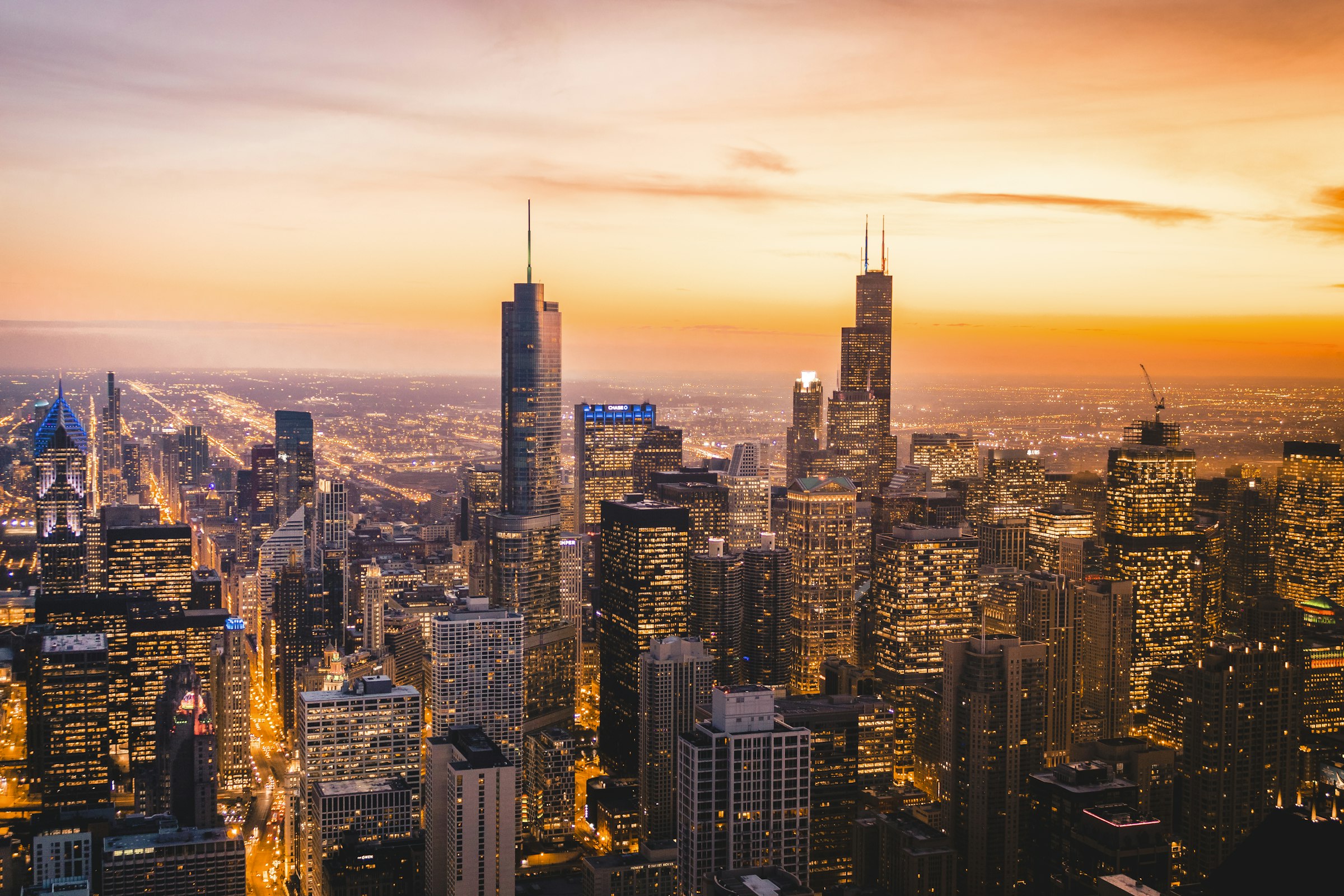 The Chicago skyline lit up at night from above.