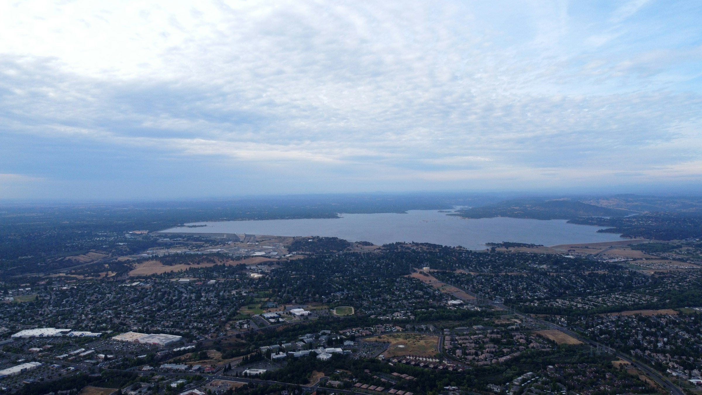Folsom Lake beyond the suburbs east of Sacramento. The race starts below the dam at the lake's south-west corner, the highest point on the course. Photograph: Zalman Grossbaum, Unsplash.