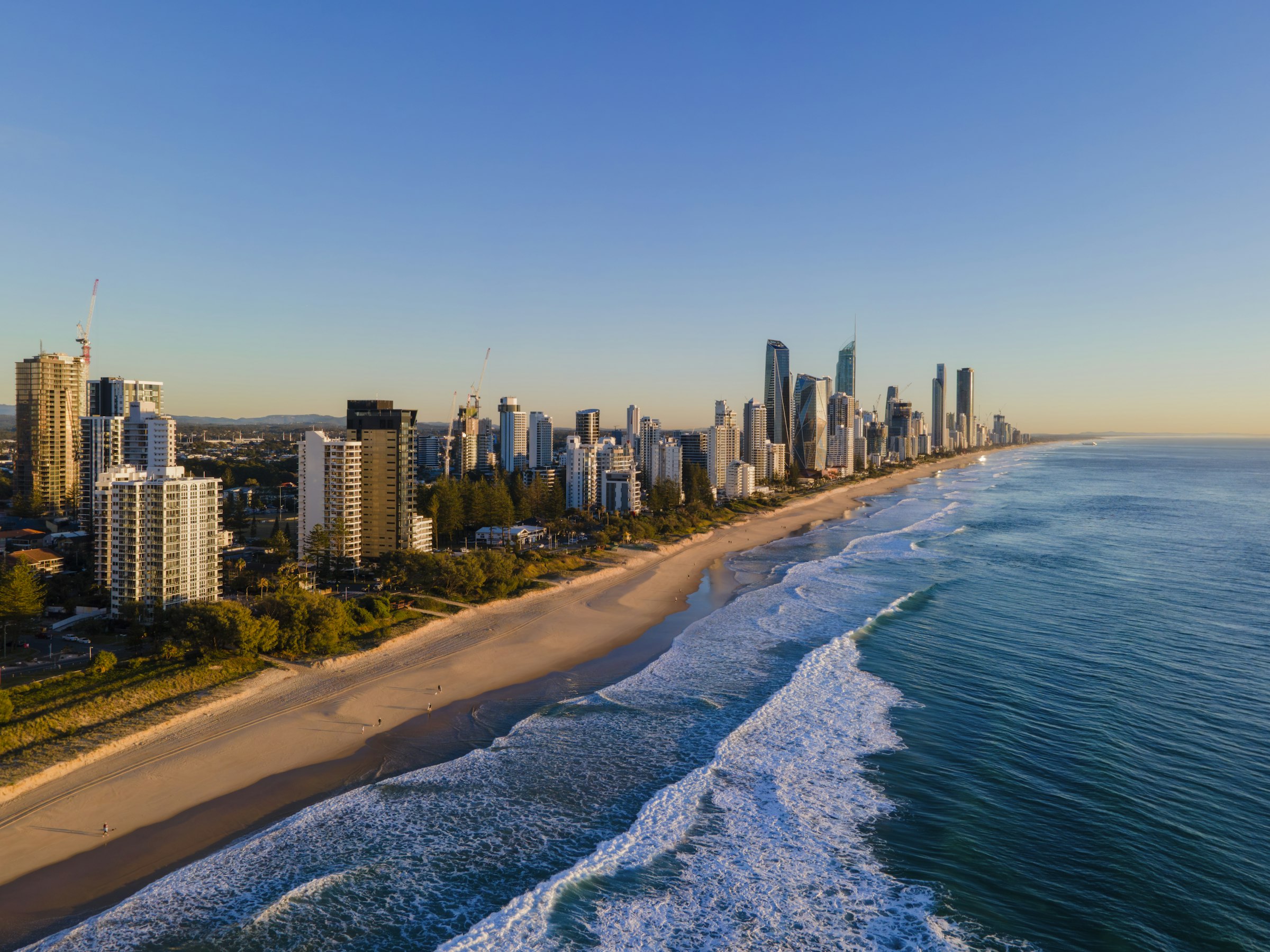Main Beach and Surfers Paradise in early-morning light. The course runs along behind this beach in both directions. Photograph: Peter Cover, Unsplash.