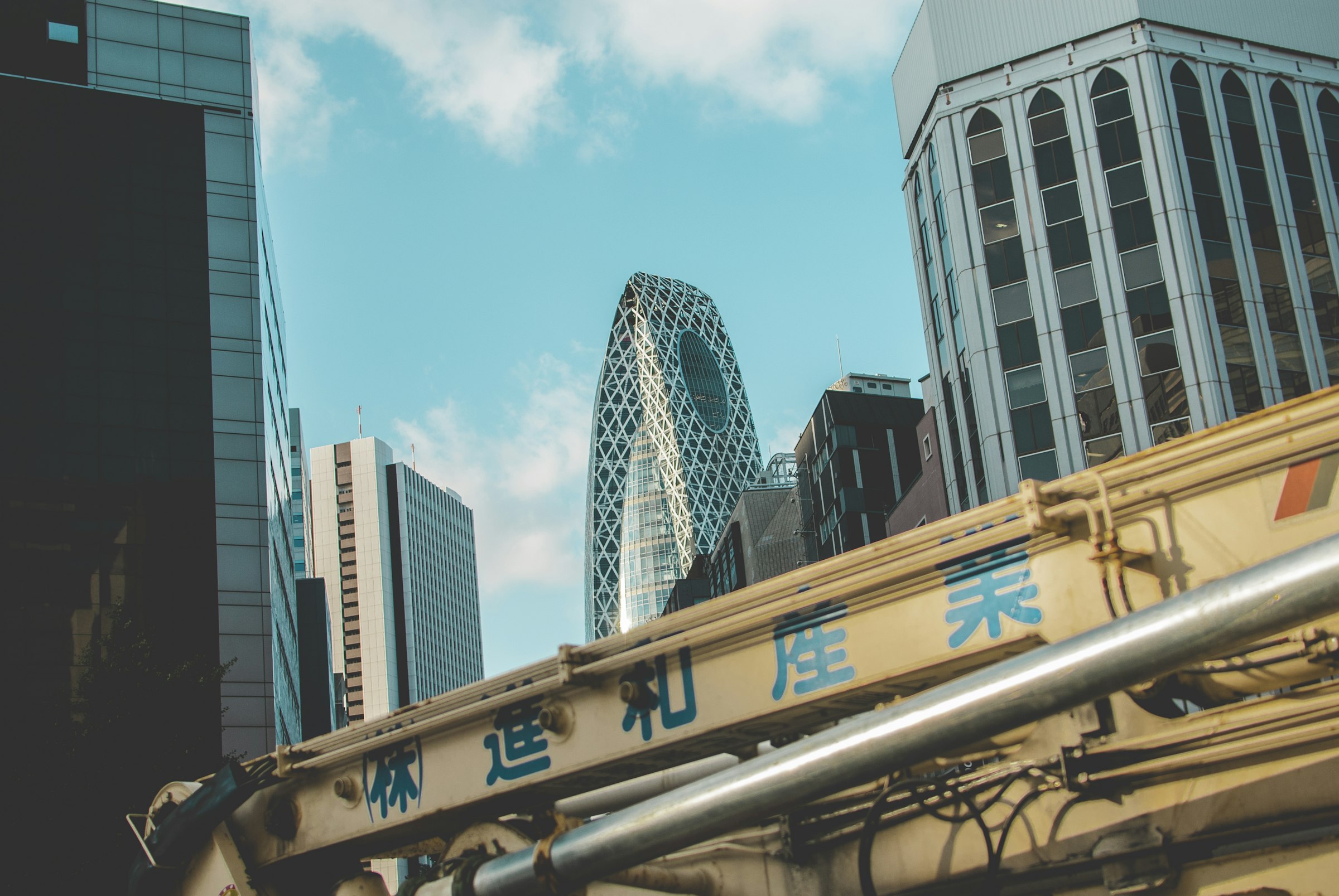 Shinjuku towers seen from street level on a clear day.