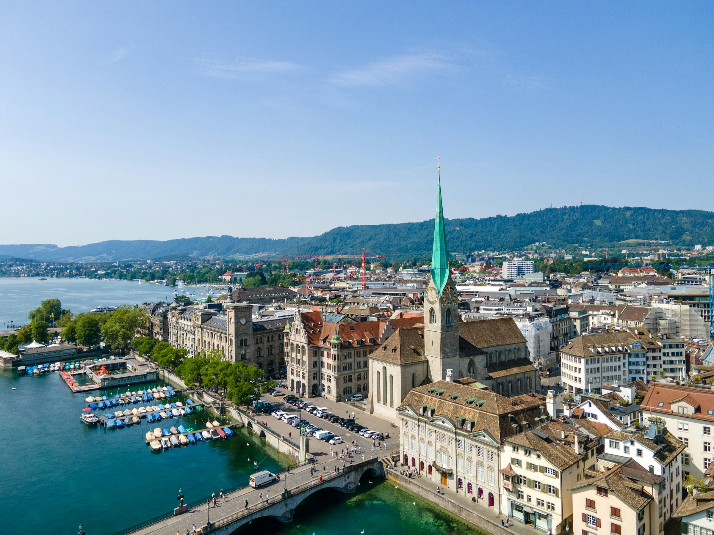 The Limmat and the Münsterbrücke from above, with the Fraumünster's green spire, the old town and, on the left, Lake Zurich.
